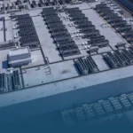 Aerial view of a large data center rooftop with rows of cooling units and equipment, PODTECH logo in the upper-left corner.