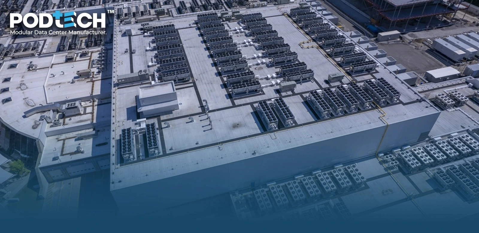 Aerial view of a large data center rooftop with rows of cooling units and equipment, PODTECH logo in the upper-left corner.